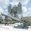 A cement plant with many large concrete mixers.